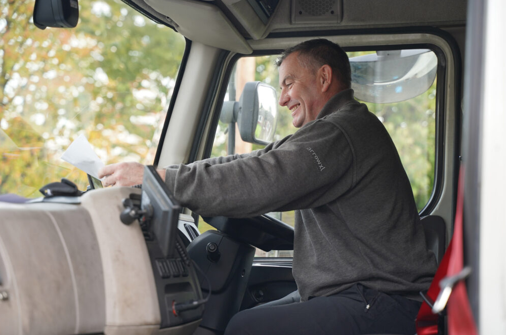 A person sitting in a truckAI-generated content may be incorrect.