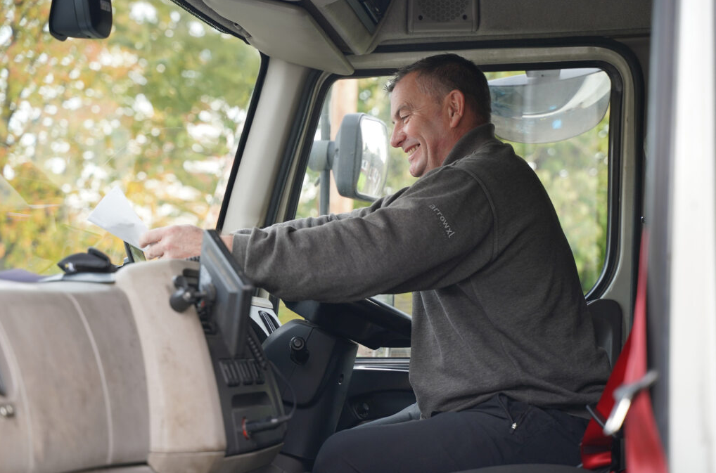 A person driving a truckAI-generated content may be incorrect.