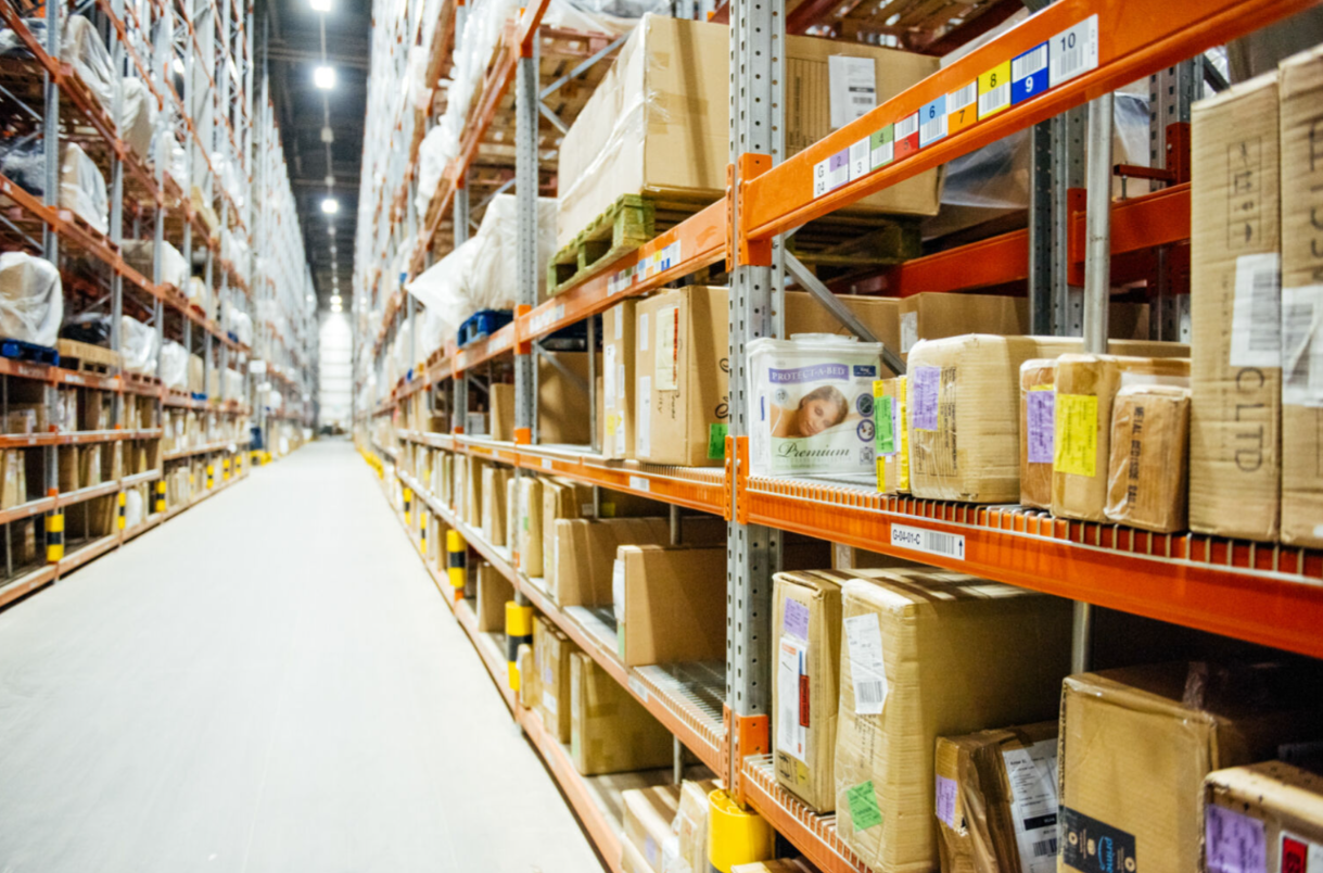 A warehouse with boxes on shelvesAI-generated content may be incorrect.